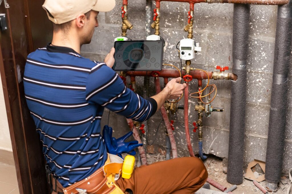Plumber is repairing the pipes