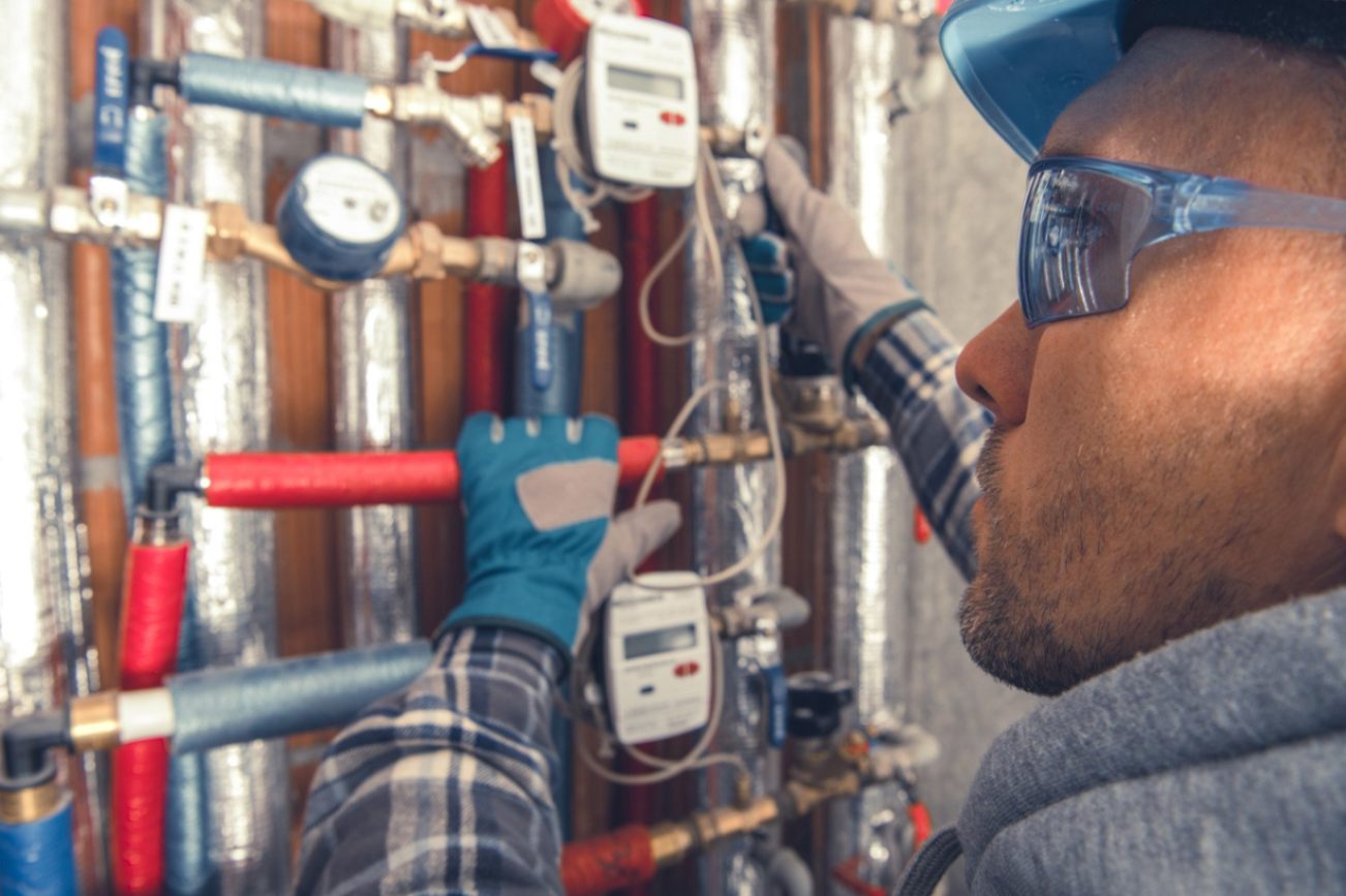 Plumber is heating the pipes