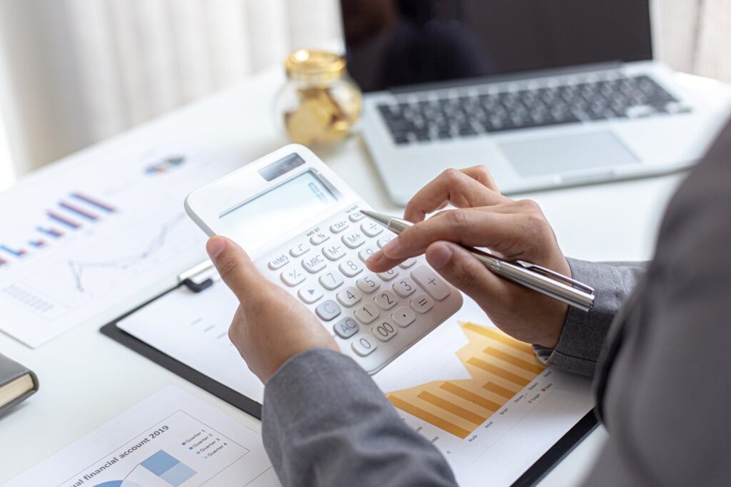 Accountant calculating the profit of plumbing business